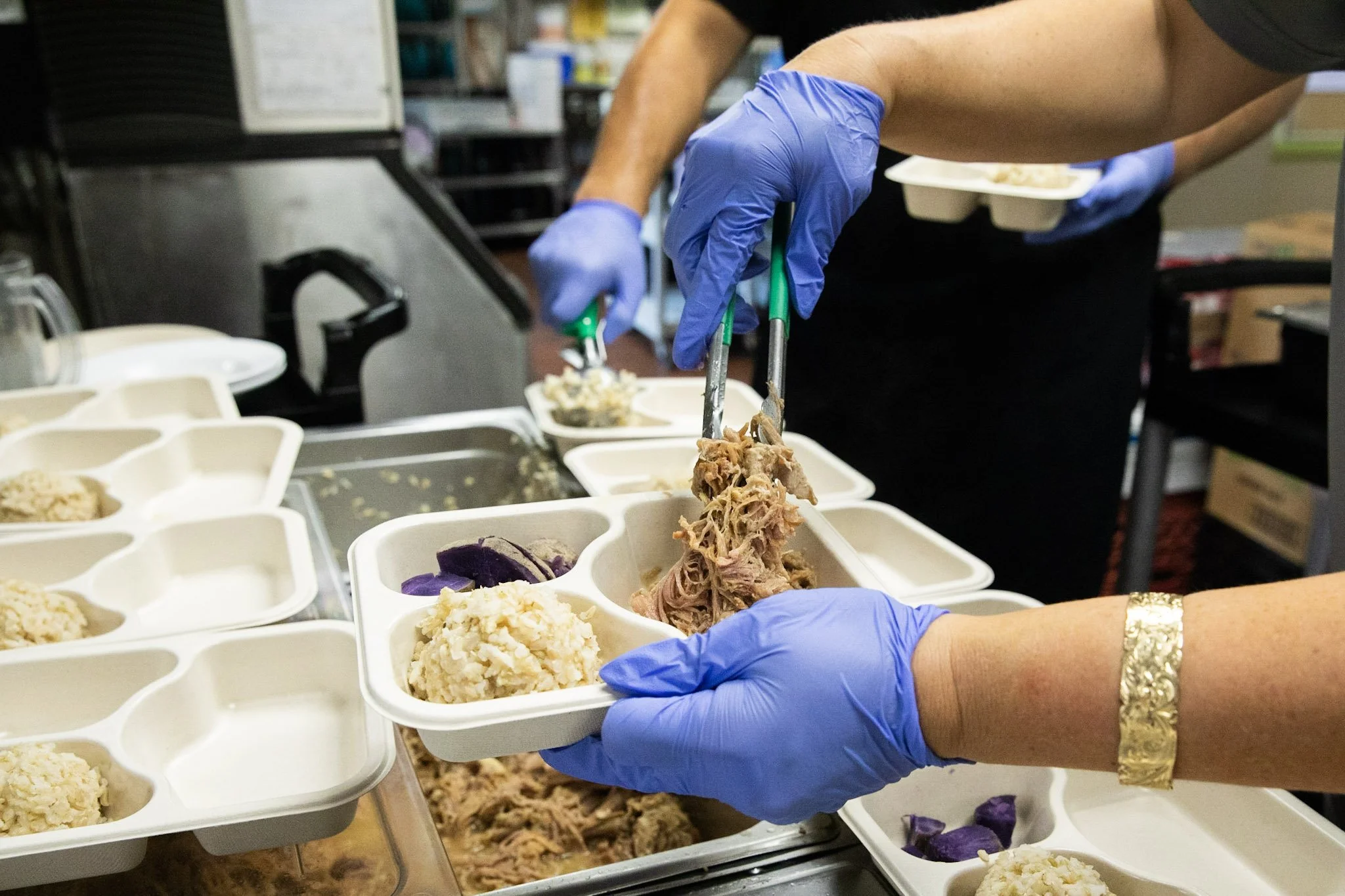 Chef preparing balanced meals for the Meal to Go service