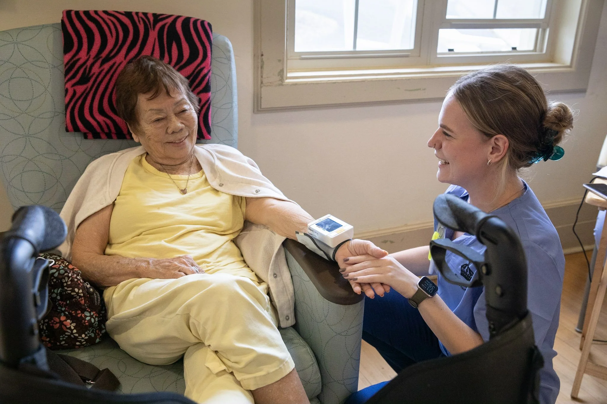 Nurse of the Lunalilo Home performing check ups on resident kūpuna