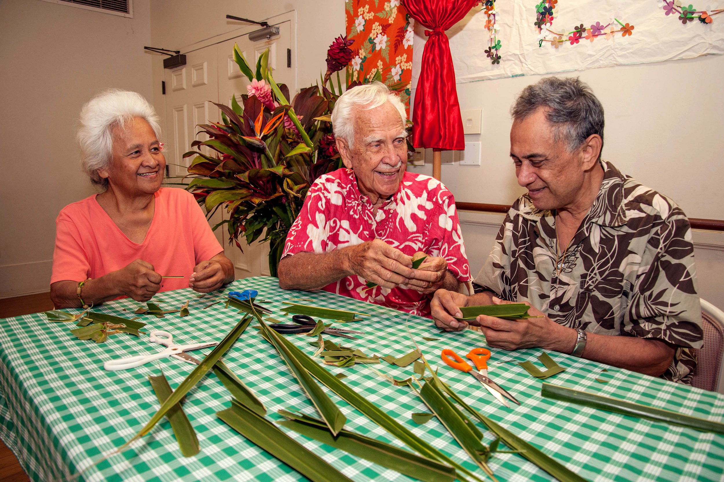 Modern image of kūpuna performing traditional activities together within the Lunalilo Home