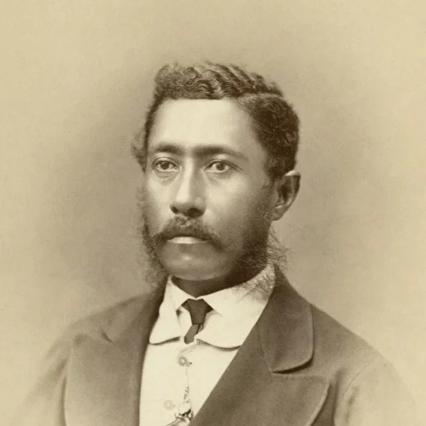Historical headshot photo of King Lunalilo in a formal suit