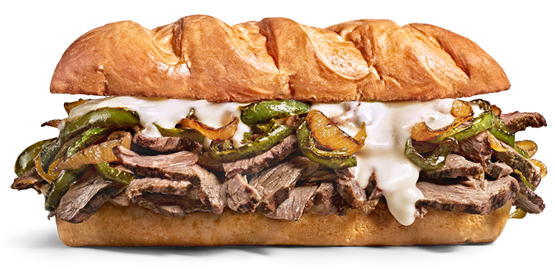 Philly cheesesteak sandwich with sliced beef, green peppers, onions, and melted cheese on a hoagie bun.