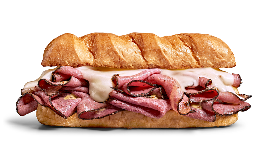 A submarine sandwich with sliced roast beef, melted white cheese, and a toasted baguette.
