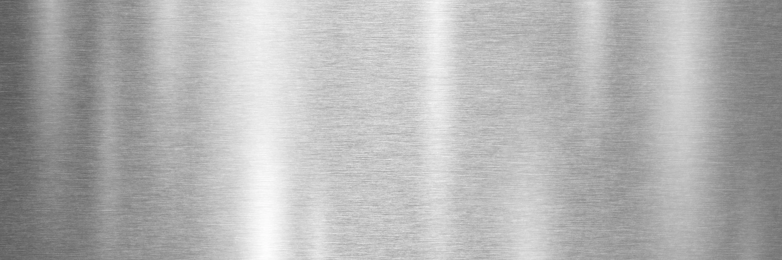 Close-up view of a stainless steel surface with a brushed metal texture.