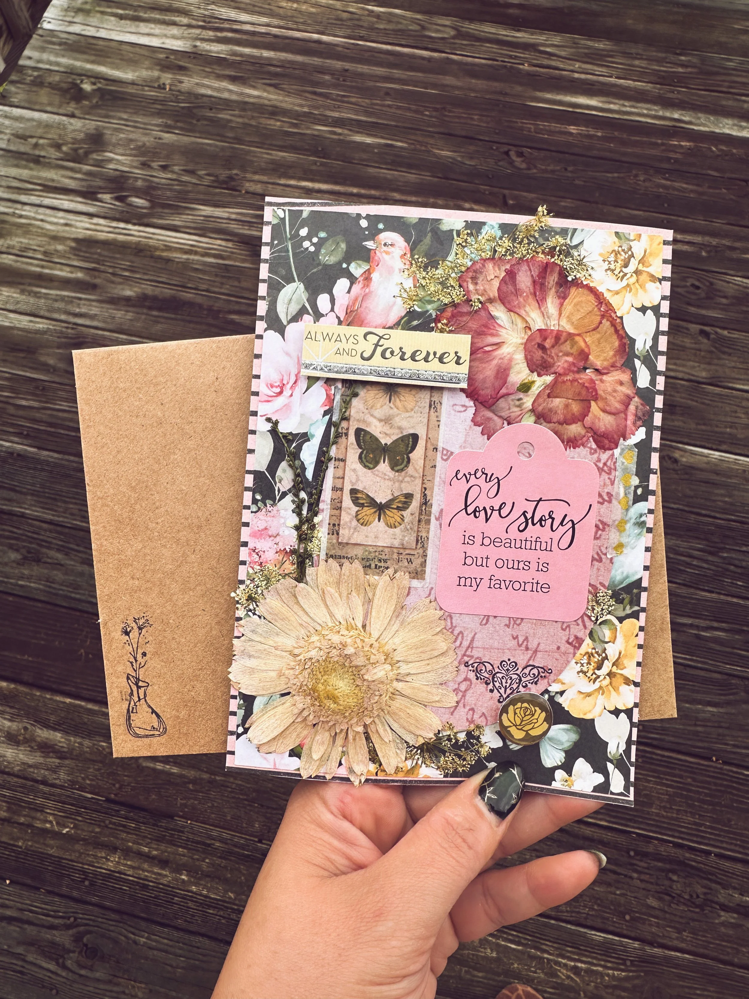 handmade vintage themed wedding card with pressed flowers and other embellishments
