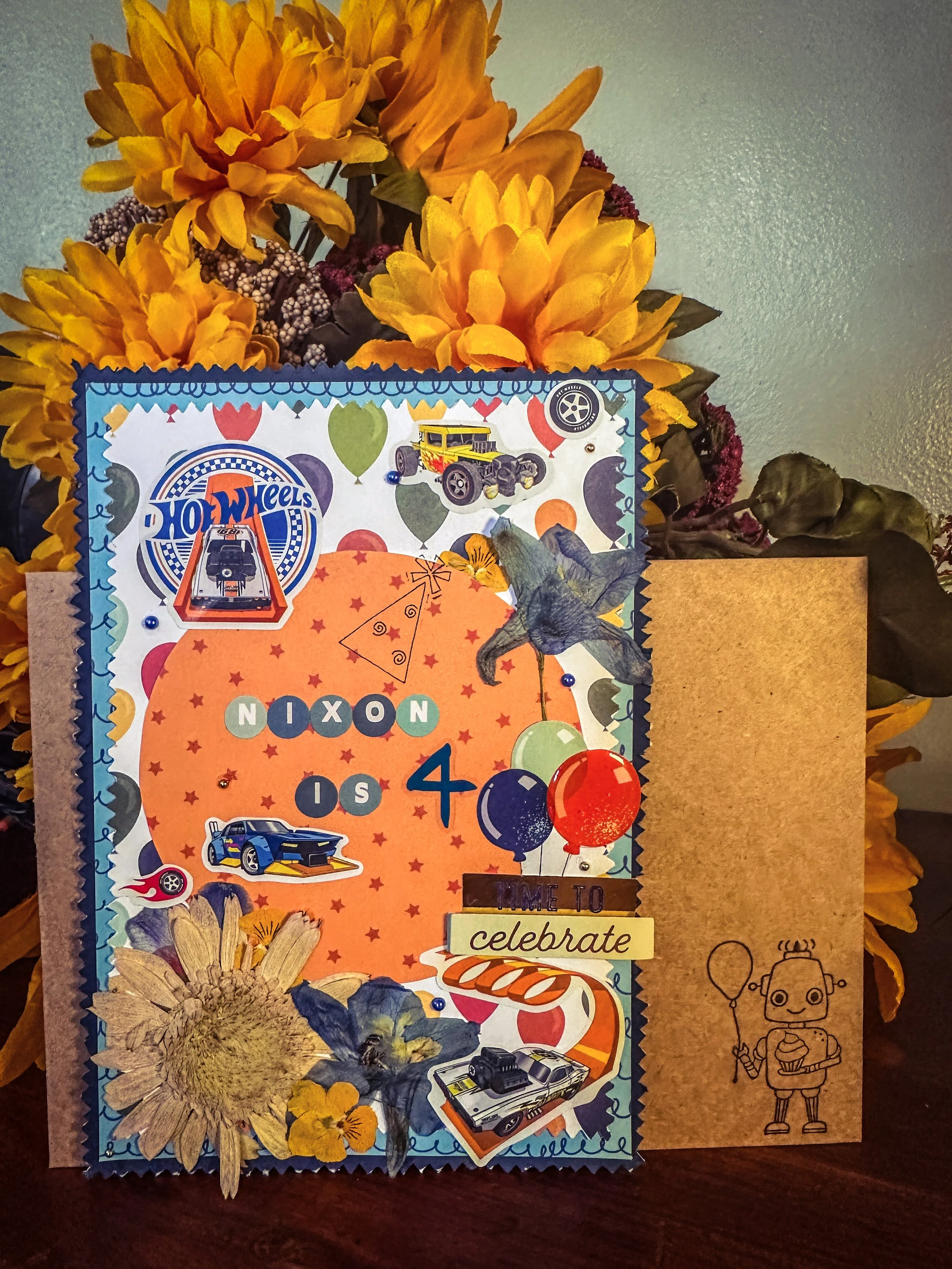 handmade hot wheels themed kid birthday card with pressed flowers and other embellishments