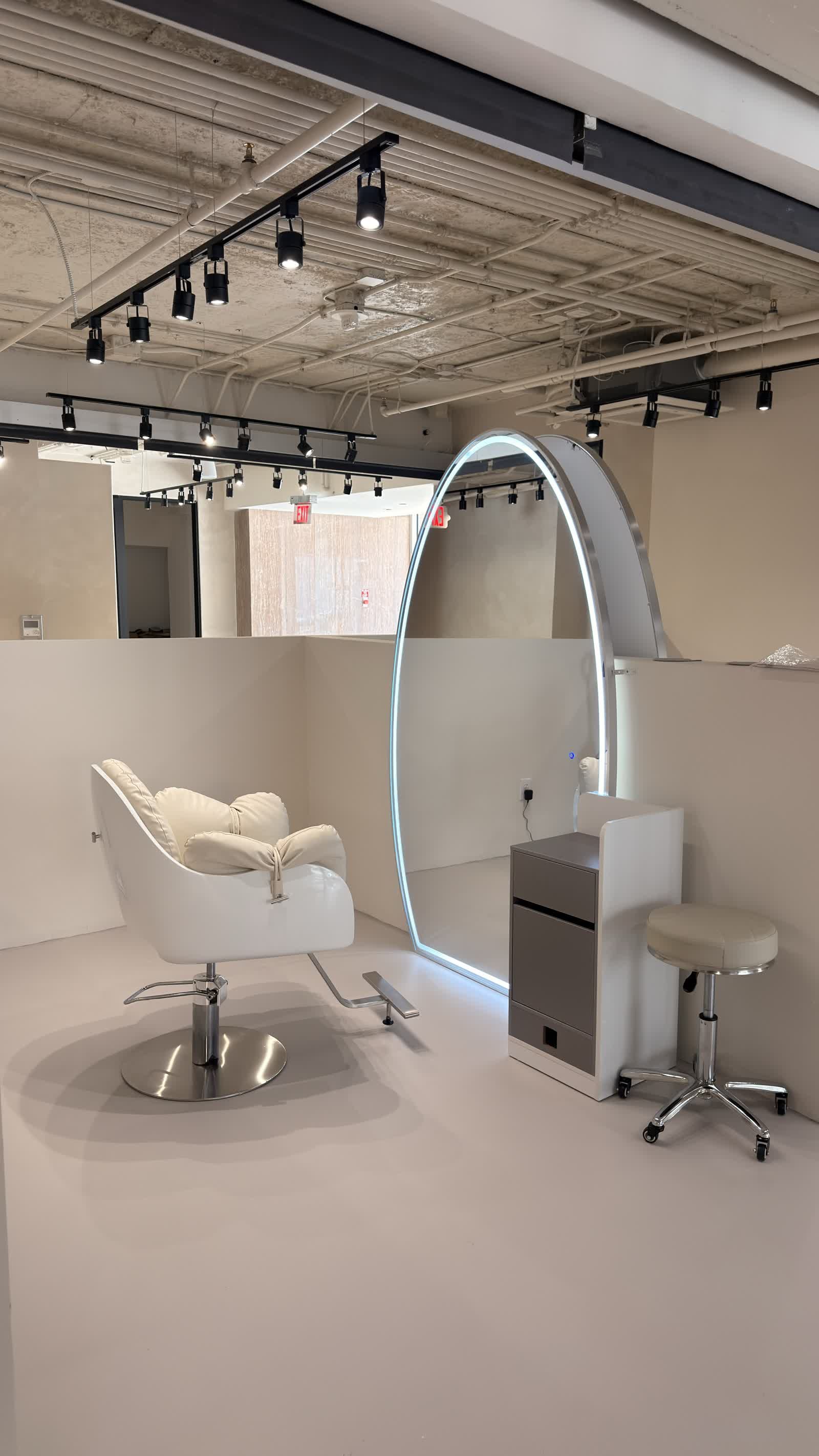 Monarch Loft with lit oval mirror