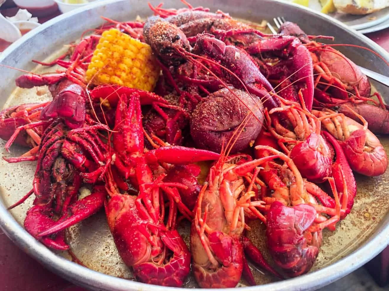 Plate of boiled crawfish and corn