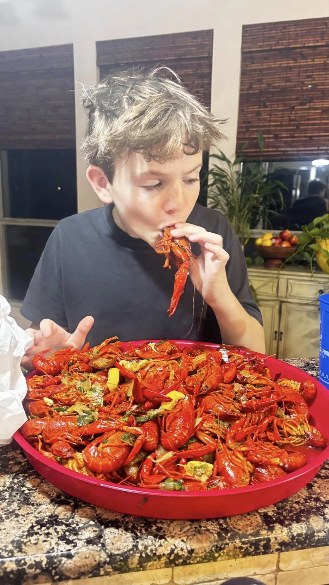 dawns son eating crawfish.jpg