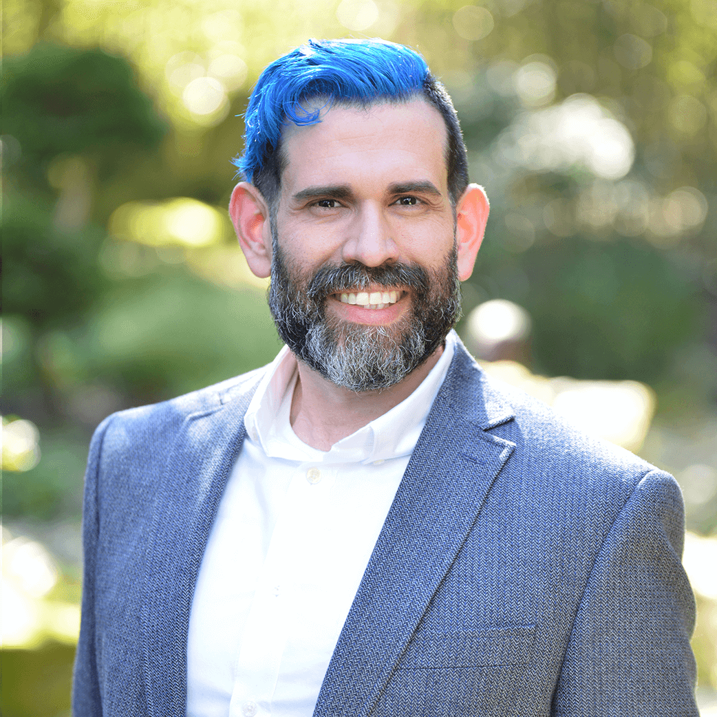 jon looking professional and spiffy with bright blue hair