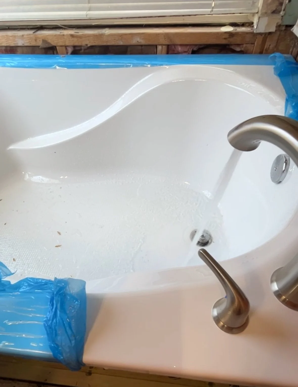 New bath tub and water faucet installation for a bathroom remodeling project in Dallas, Texas.