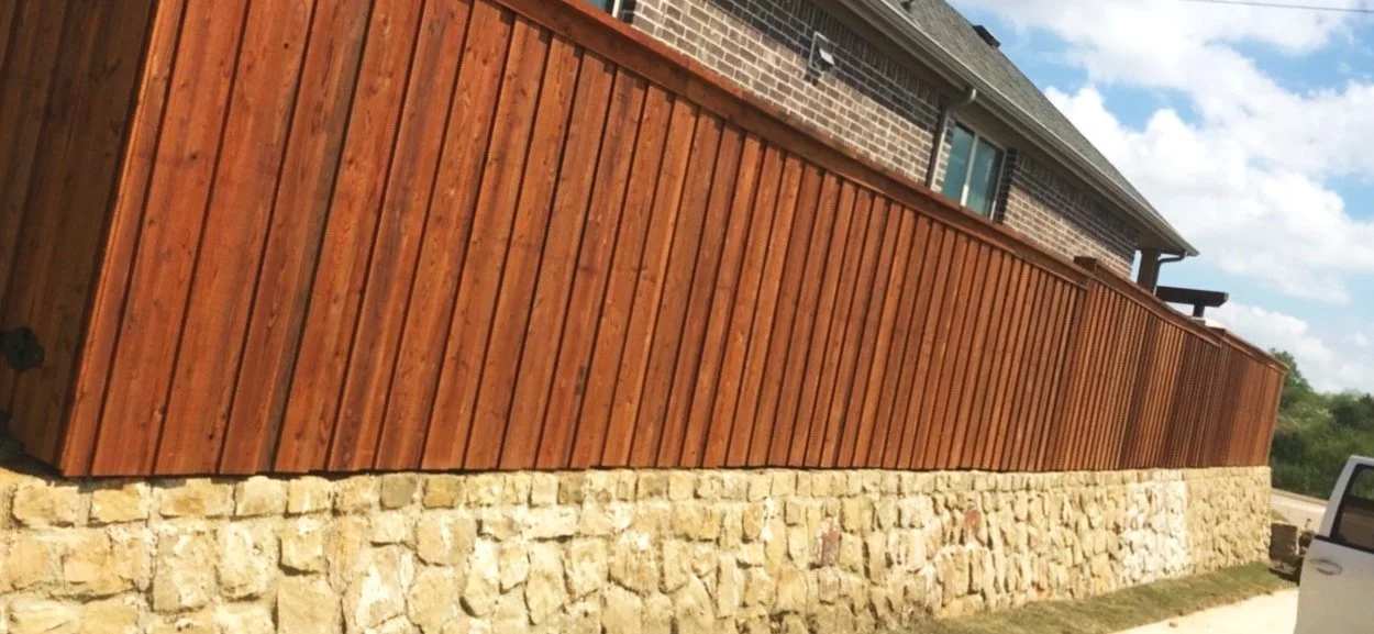 Installation of 6 foot tall board on board privacy fence with cap board and trim finish using cedar wood in North Lake, Texas.
