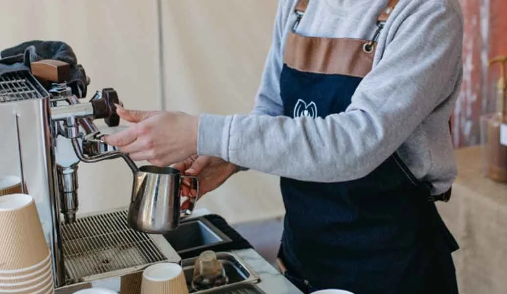 Barista preparing specialty coffee for a corporate event in Irving, Texas