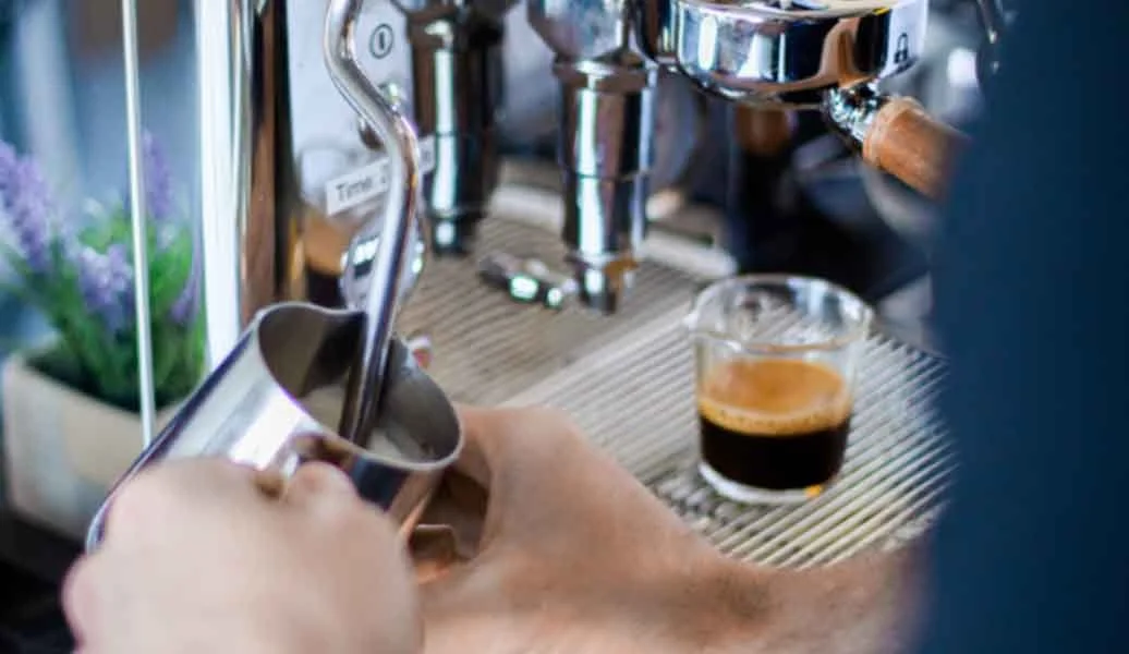 Barista preparing fresh coffee for private and social events in Arlington, Texas