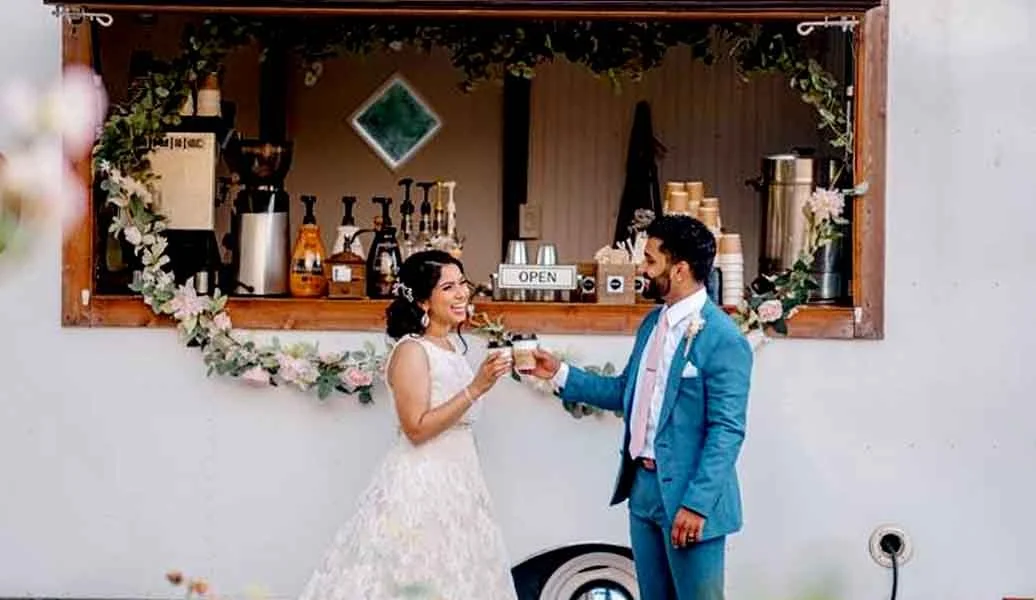 Wedding coffee cart service in Frisco, TX with guests enjoying lattes