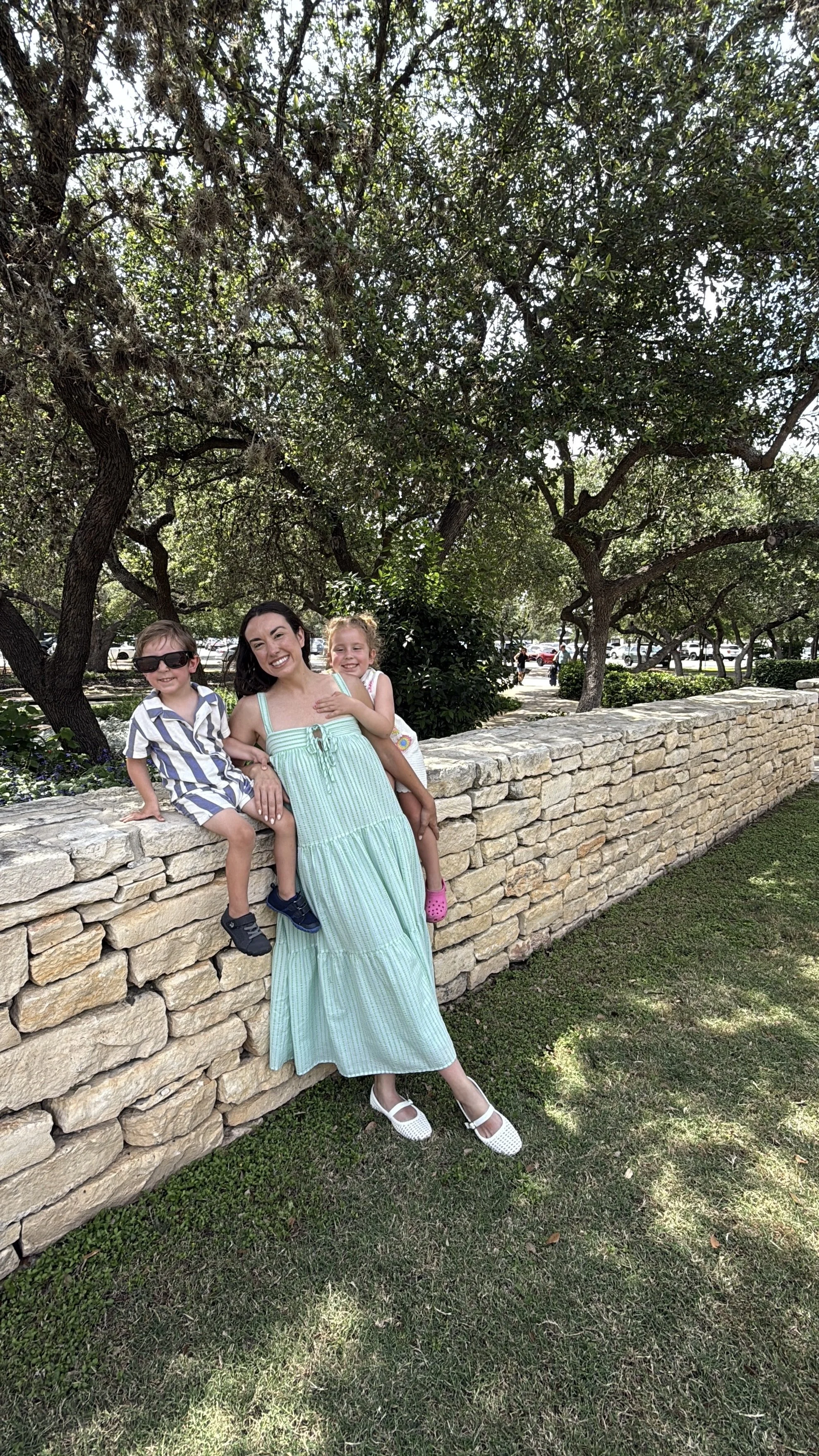 family in hill country green stripe dress blue and white striped boys outfit