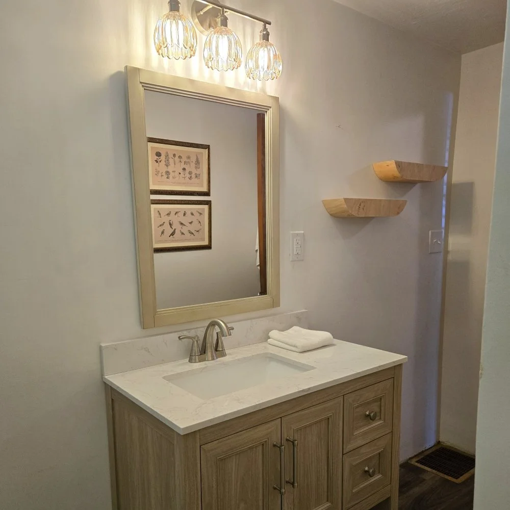 Bathroom vanity, mirror, and light replaced in Carol Strea