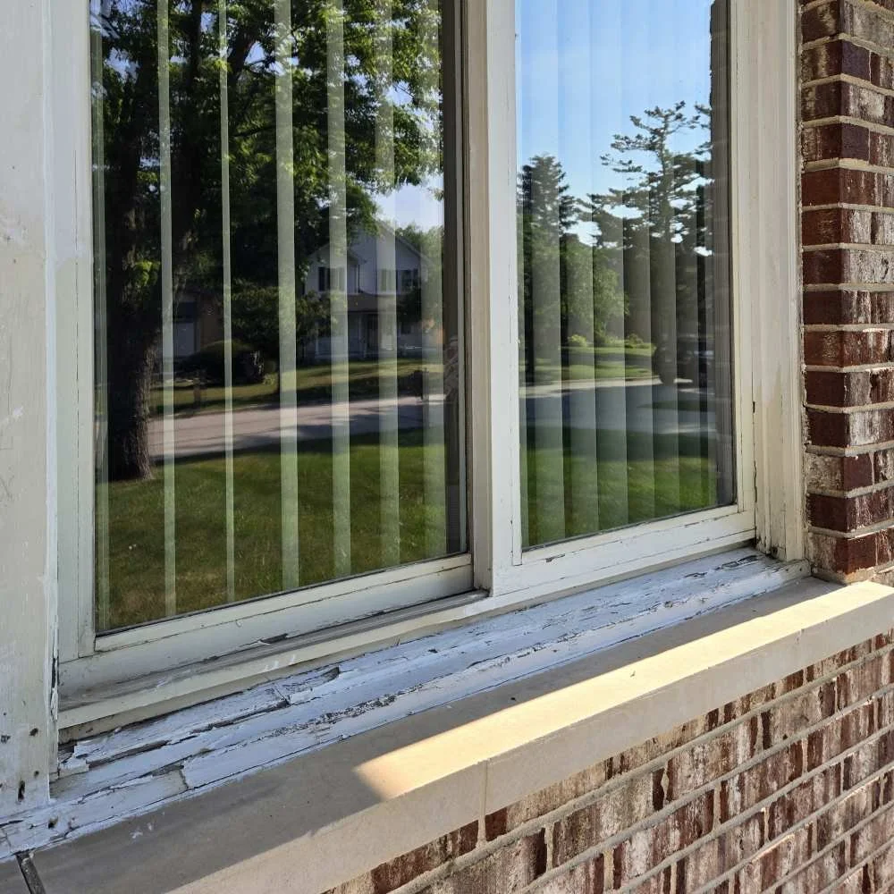 BEFORE: Wood window frames and trim with peeling paint in Elmhurst
