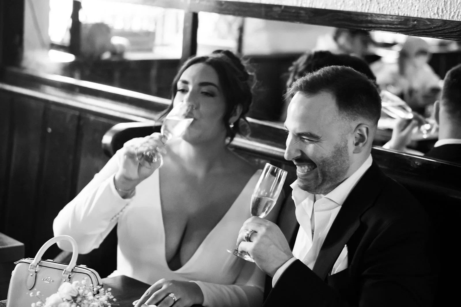 couple drinking champagne after eloping