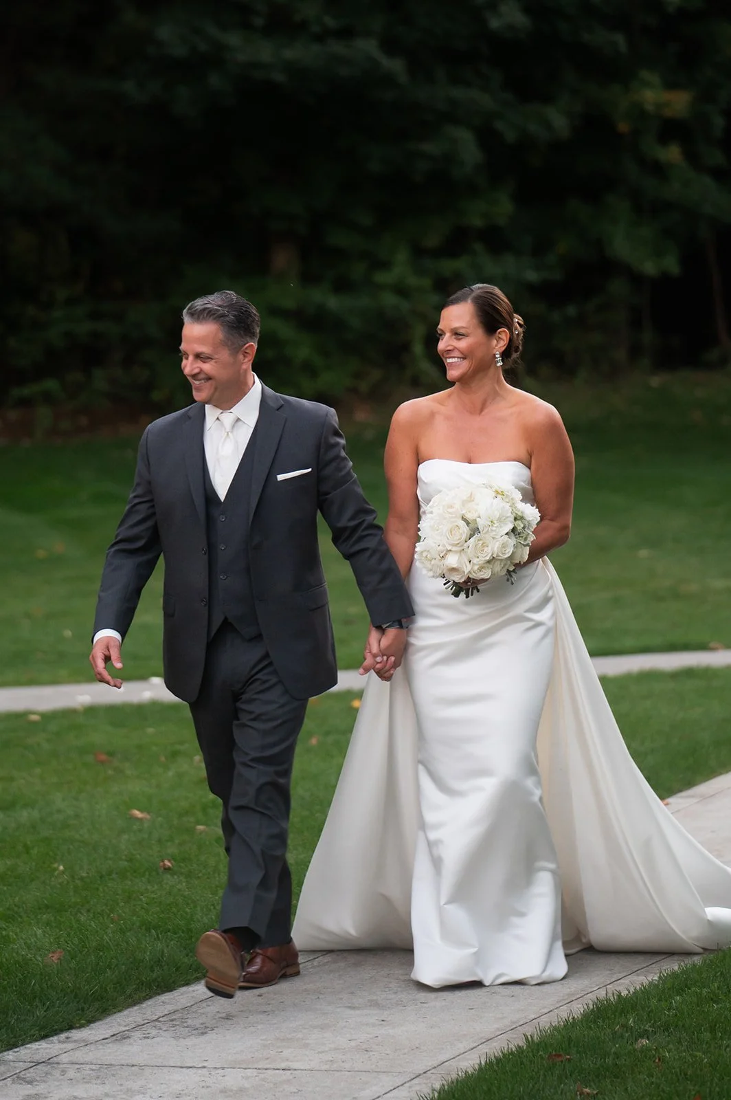 Timeless Bride and Groom walking portrait