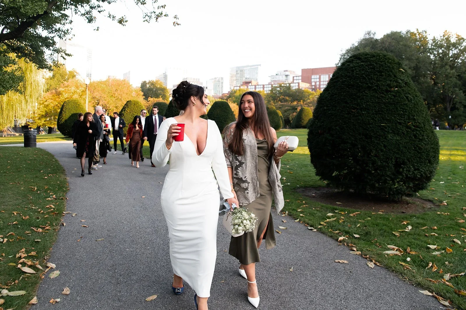 bride and friend walking in boston public garden
