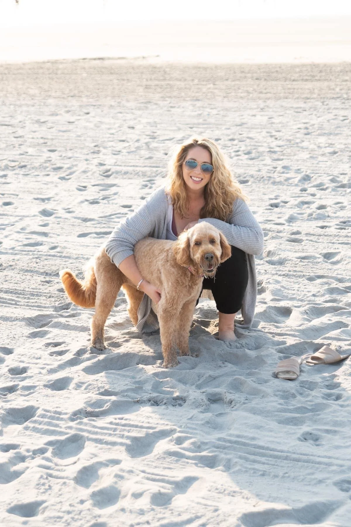 Kara with dog on beach in Maine