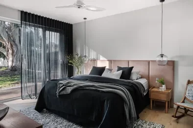 A Scandi-inspired light-filled bedroom combining warm and cool hues, styled by Hygge Design, interior designers in Melbourne.