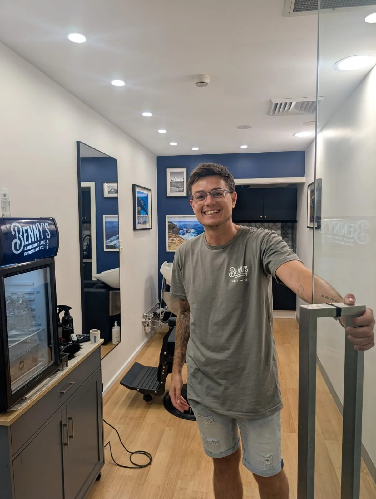 Benny welcoming clients to his premium barbershop in Potts Point, Sydney specialising in men's haircuts and fades