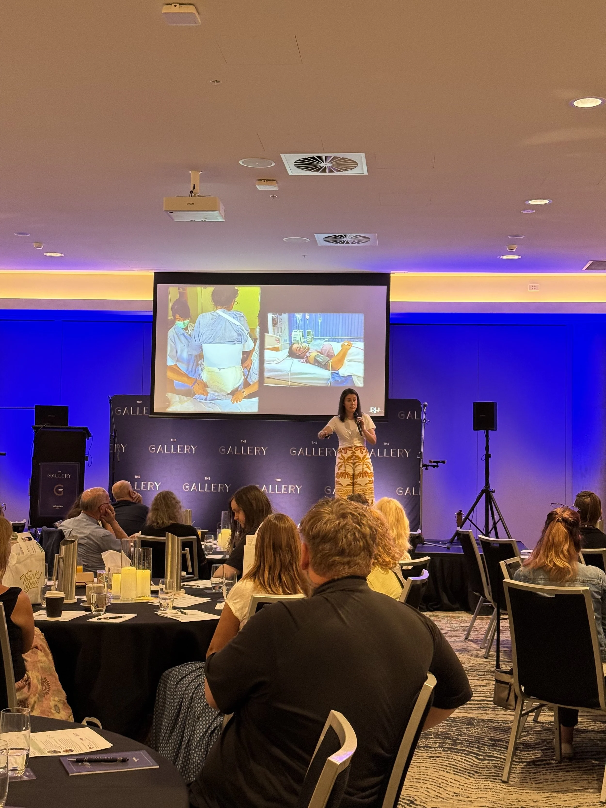 Keynote speaker Kat presenting at a Mental Health Carer's conference.