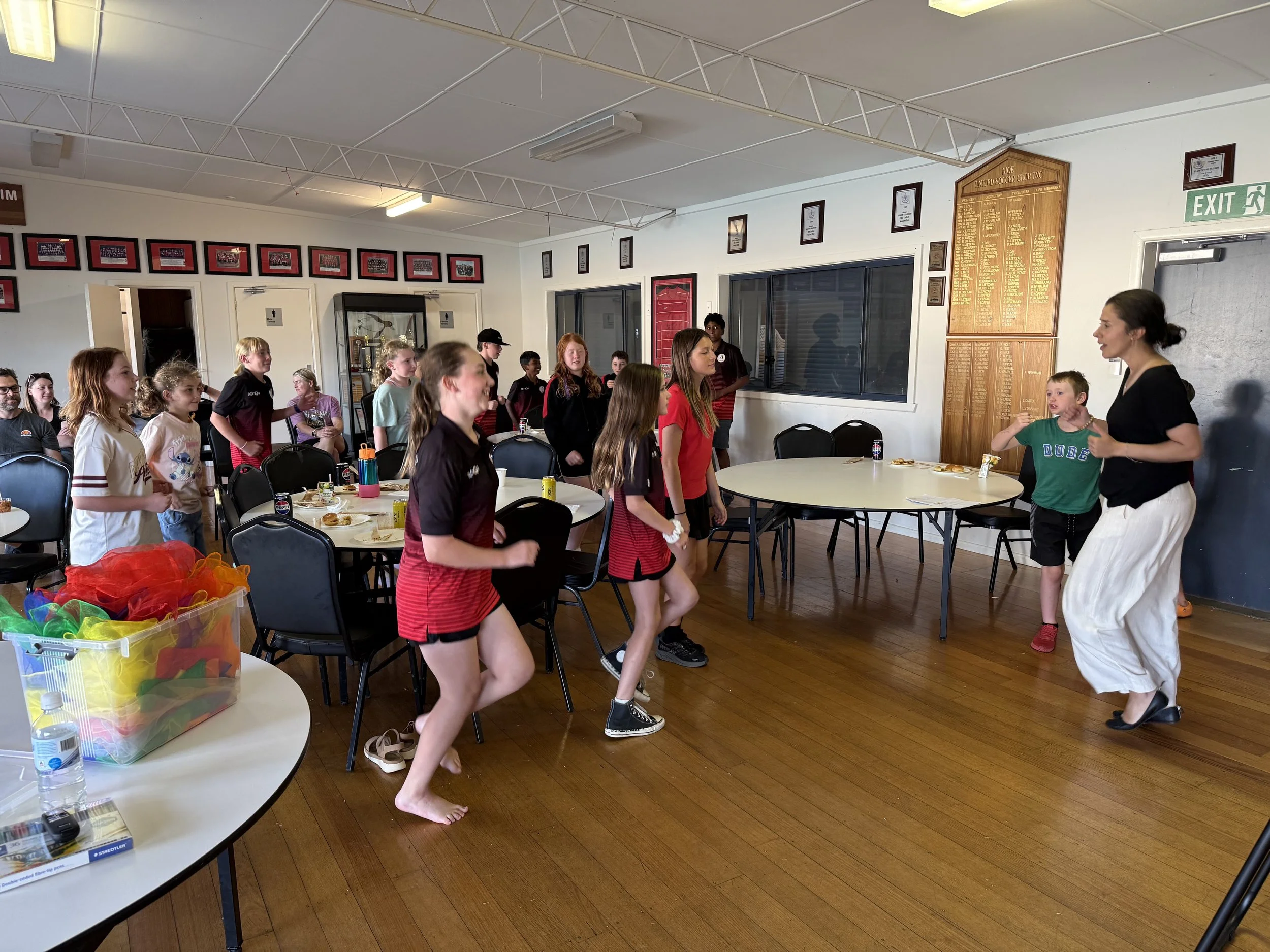 Junior athletes participating in engaging, interactive activities for understanding of emotional regulation and emotional literacy and how to navigate pressure and overwhelm.