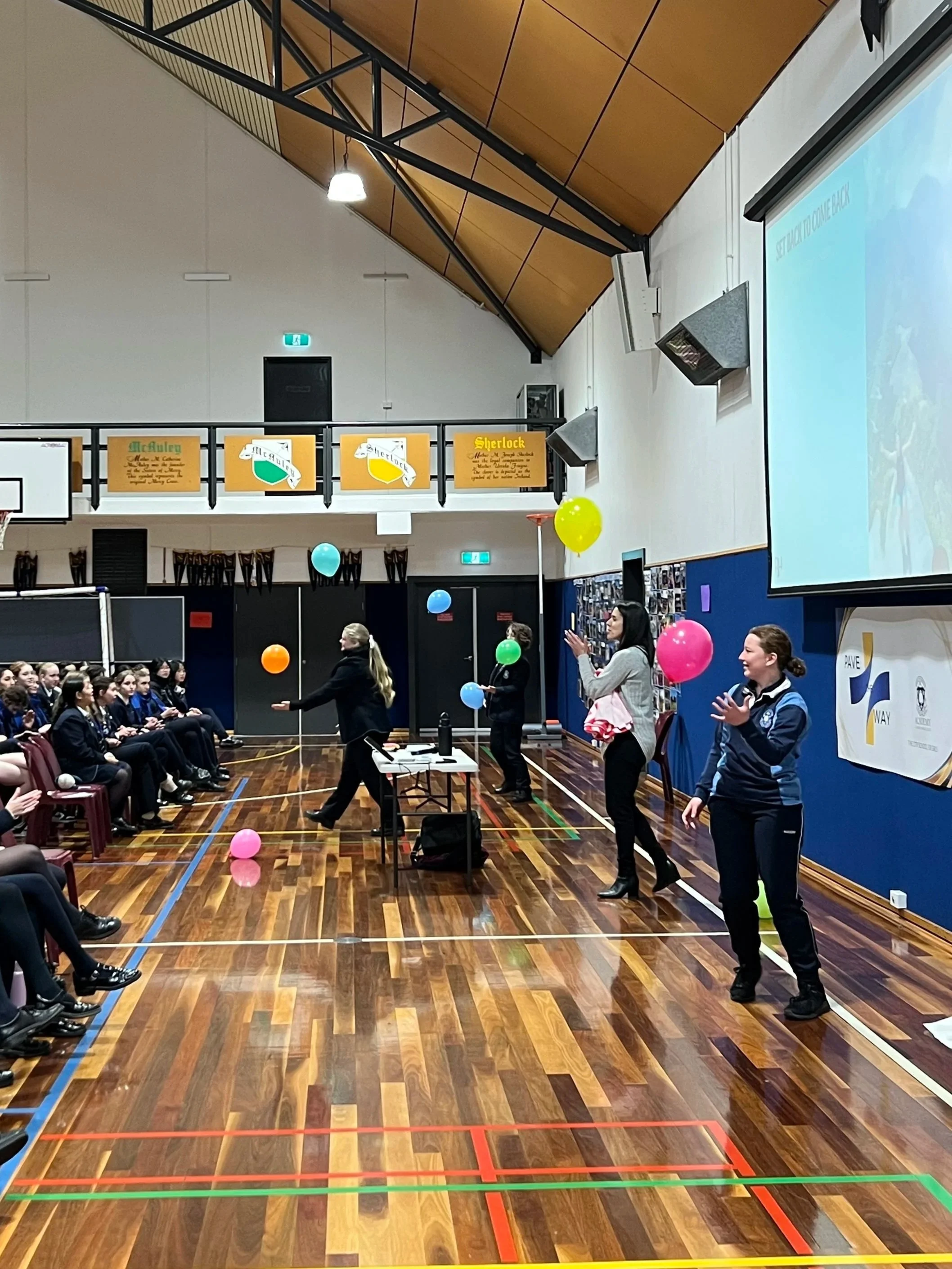 Middle school students participating in an interactive wellbeing activity during a Being Human Co workshop.