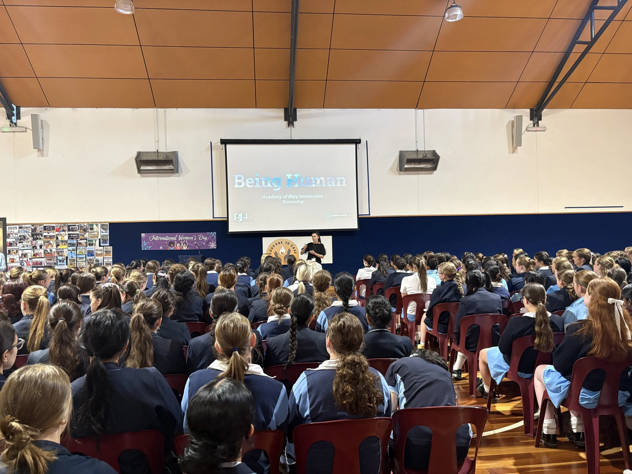 Keynote speaker Kat delivering International Women's Day presentation to Year 11 and 12 students.