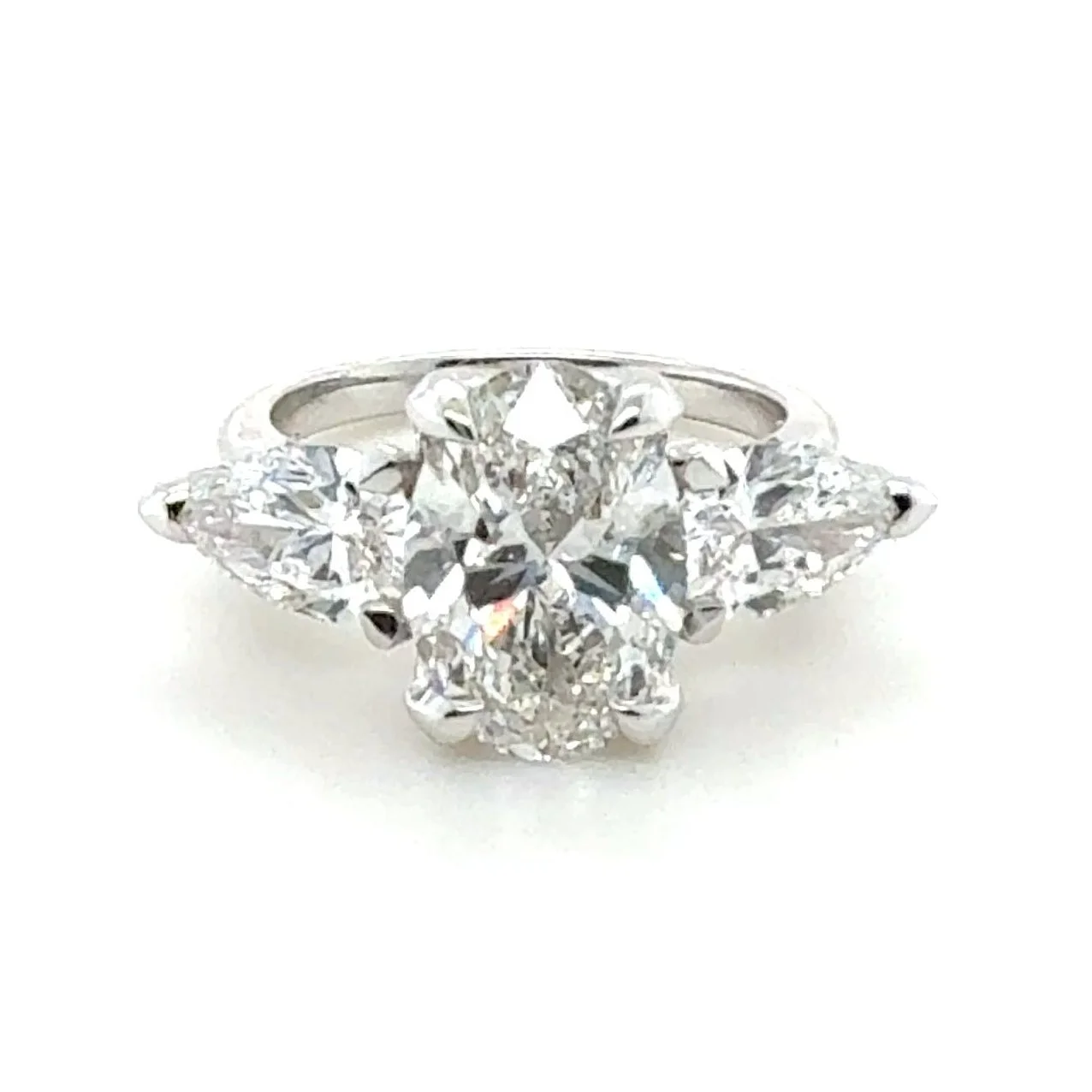 3 Stone Ocean Wave Ring - 5.69 cttw Oval ctr