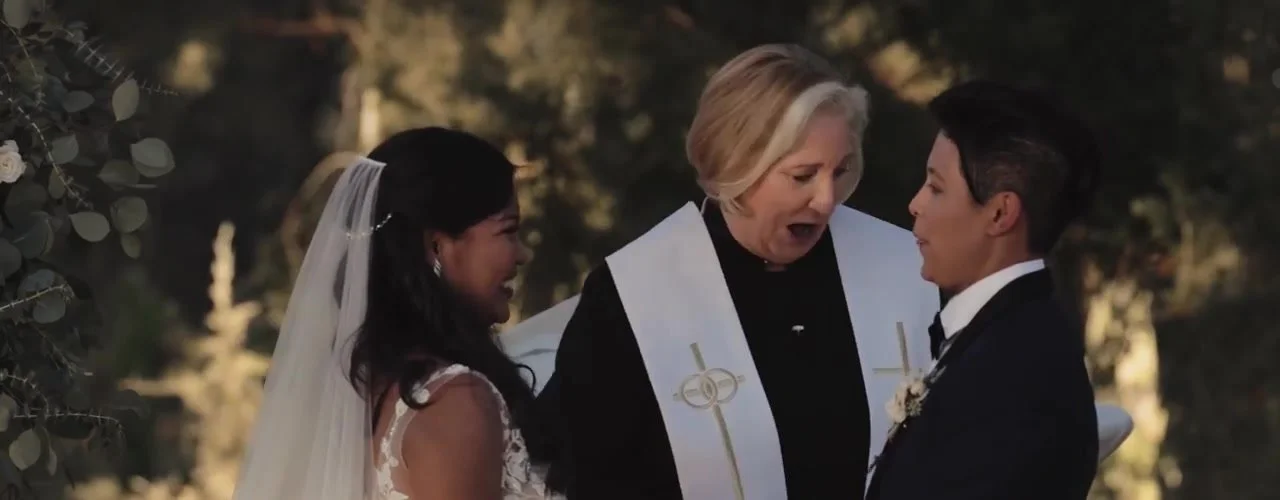 Wenjane and Susie with their officiant during vows at Sacred Oaks, Camp Lucy