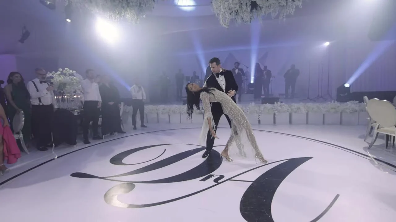 First dance dip on a circular floor monogrammed D n A