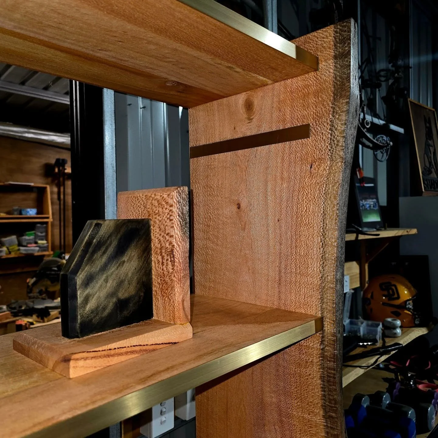 Live edge silky oak bookshelf with brass accents done and dusted. #bookshelf #brass #liveedge #woodworker #bookcase #silkyoak #fiddes #fiddesaustralia #fiddeshardwaxoil