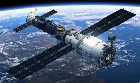 A spacecraft orbiting above Earth with solar panels extended.