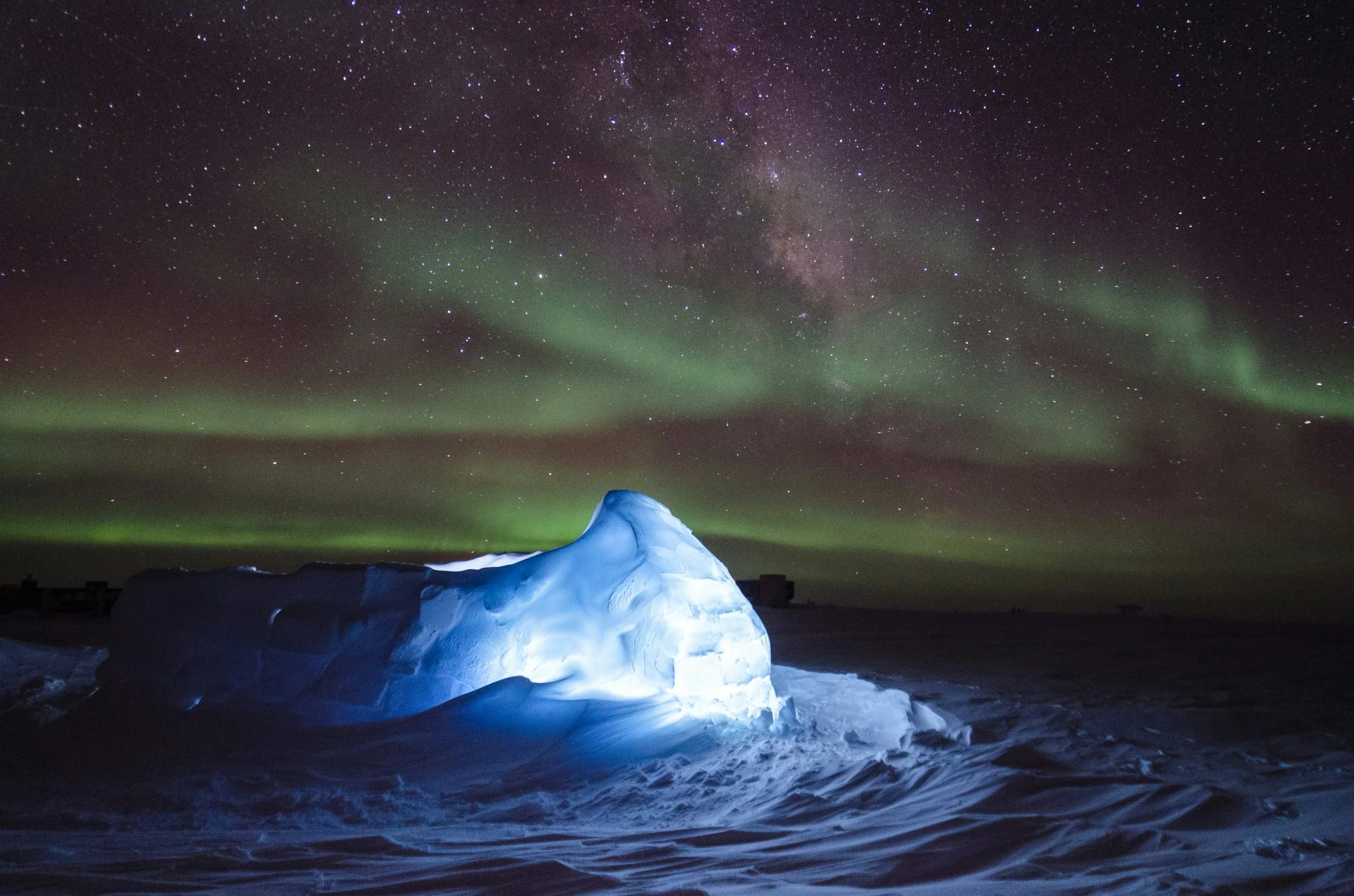 Southern lights over ice and snow landscape at night