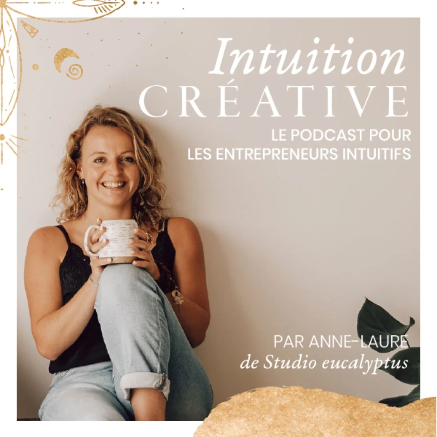 Cover of a podcast titled "Intuition Créative" featuring a smiling woman with curly hair holding a ceramic mug, sitting against a beige wall with decorative gold and black accents, and text indicating it is a podcast for intuitive entrepreneurs by Anne-Laure of Studio Eucalyptus.