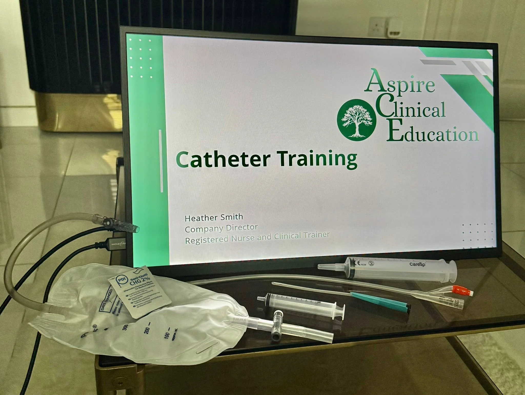 monitor displaying catheter presentation with catheter supplies infront