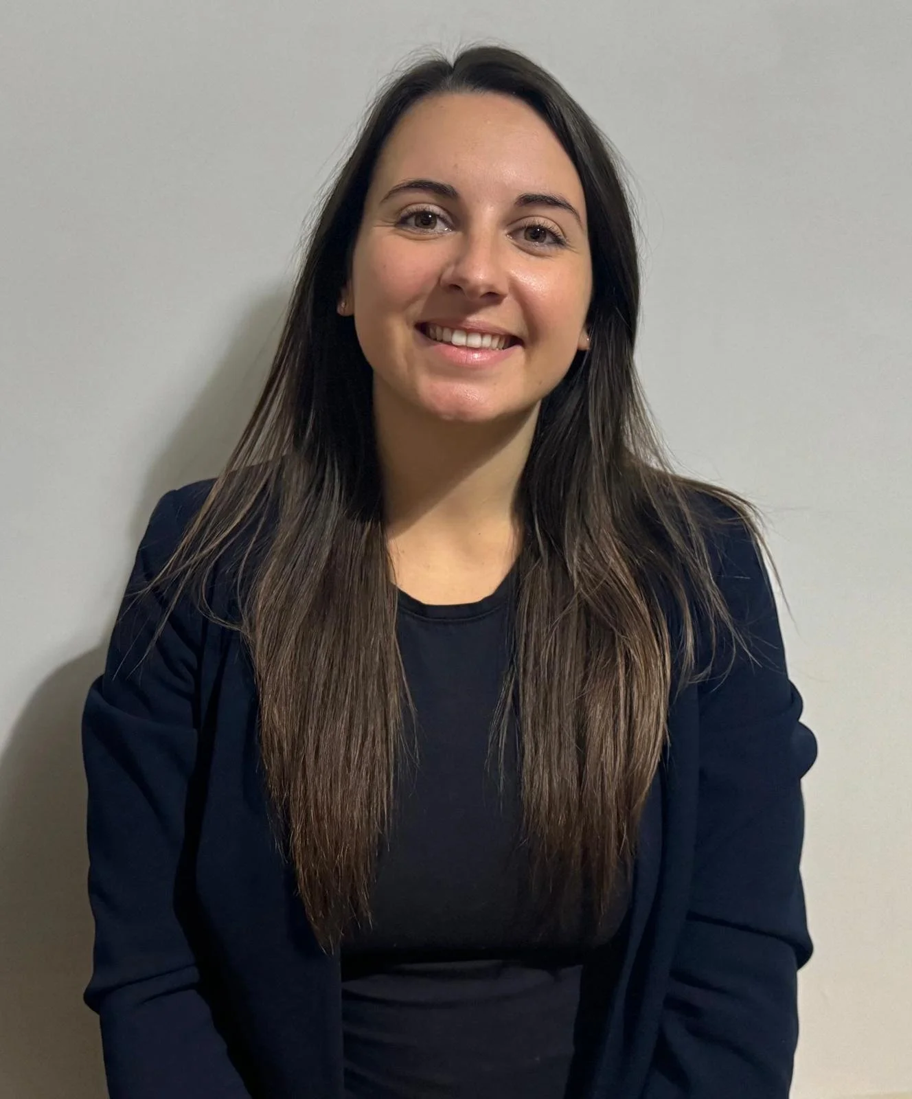 Image of nurse Heather, wearing black smart office clothing