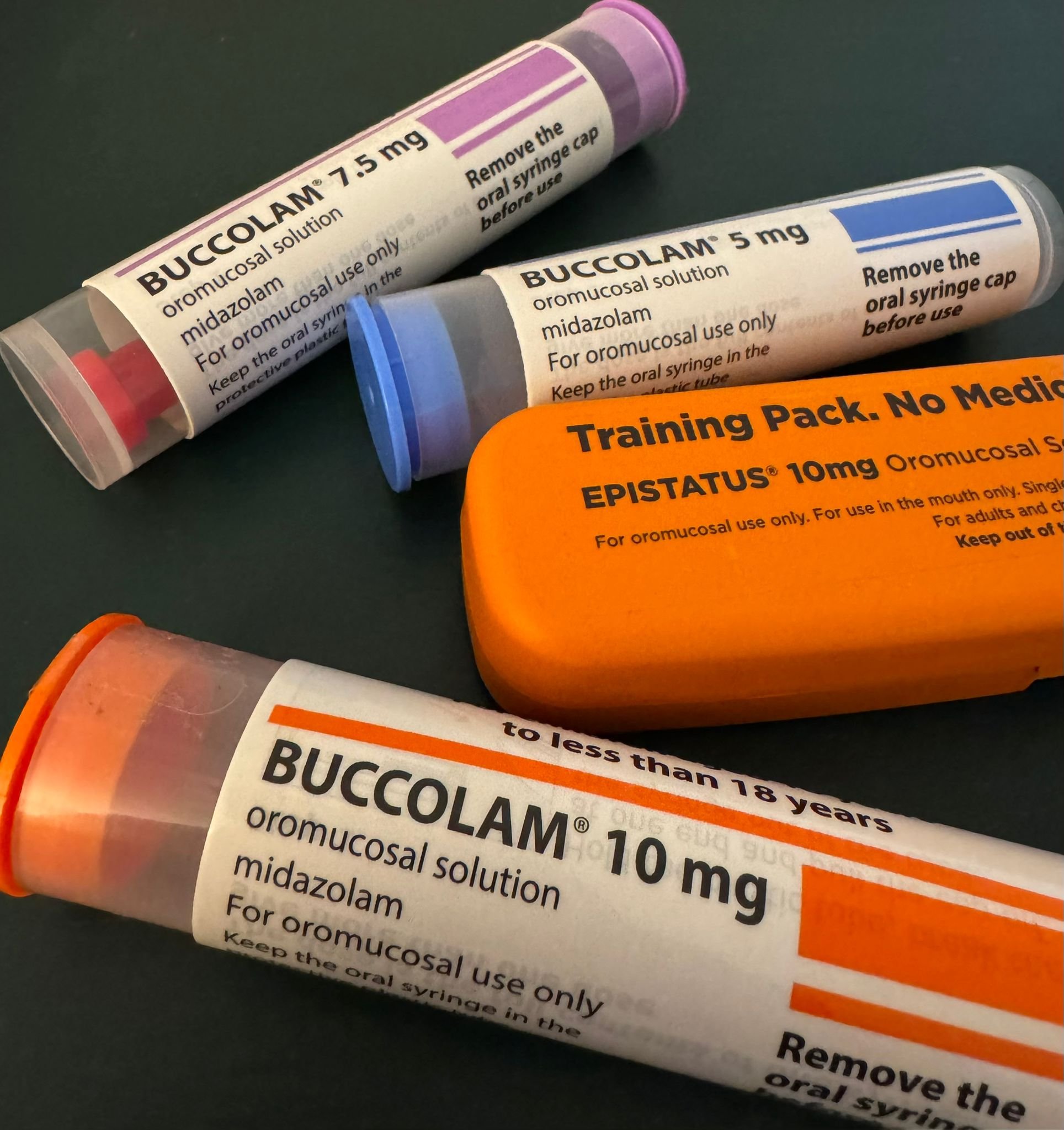 Buccolam and Epistatus training syringes close up