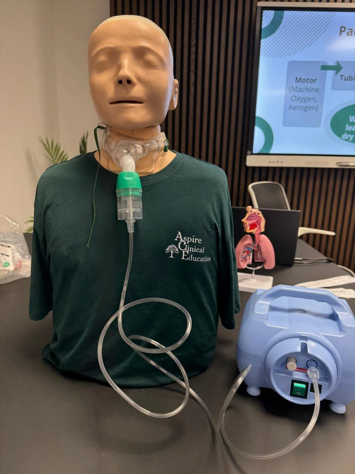 Sim manikin with tracheostomy receiving nebuliser therapy with machine