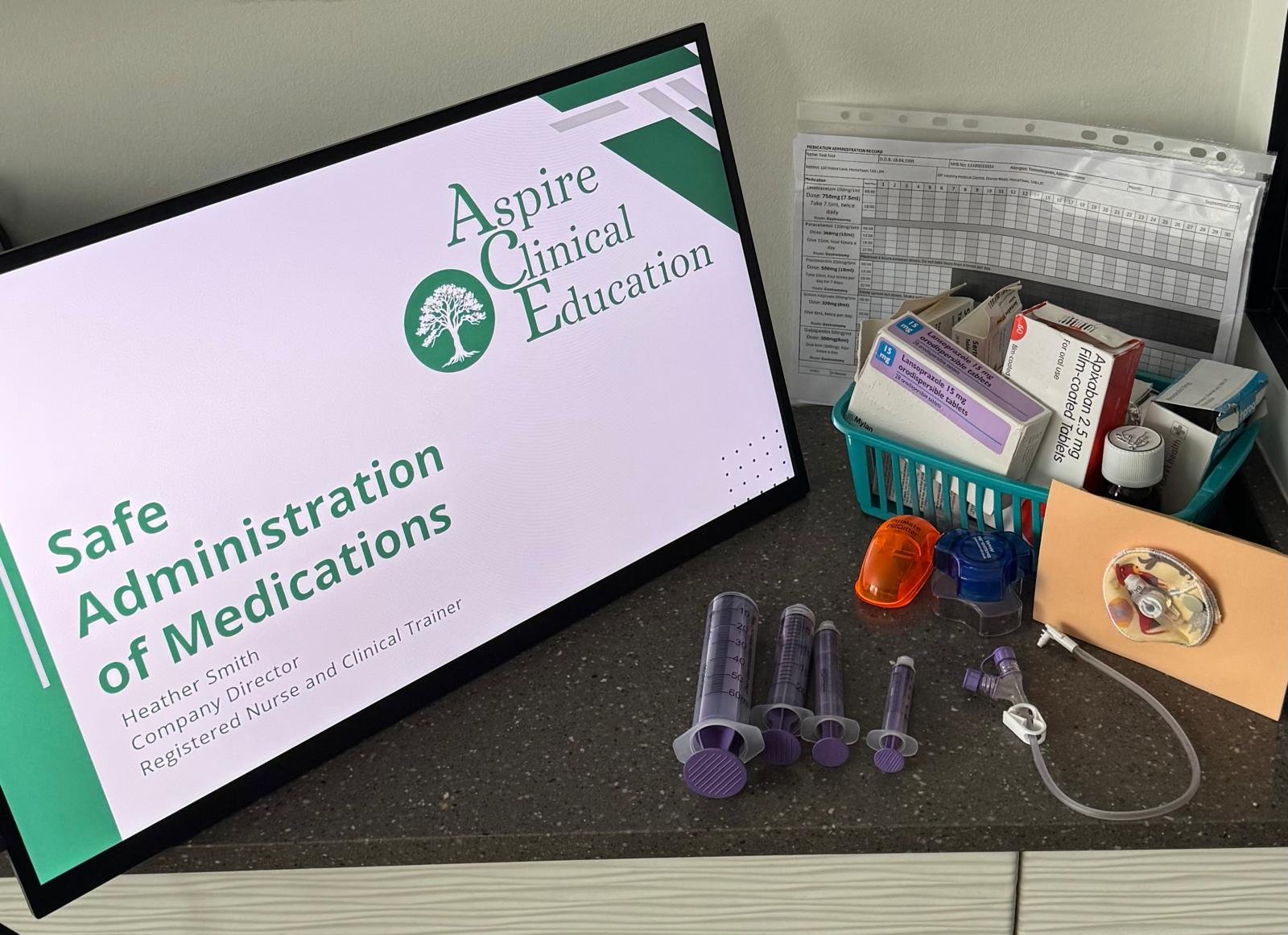 Monitor displaying medication training monitor and products for enteral medication administration