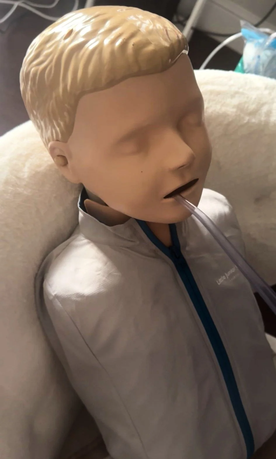 child sim manikin receiving yankaeur suction