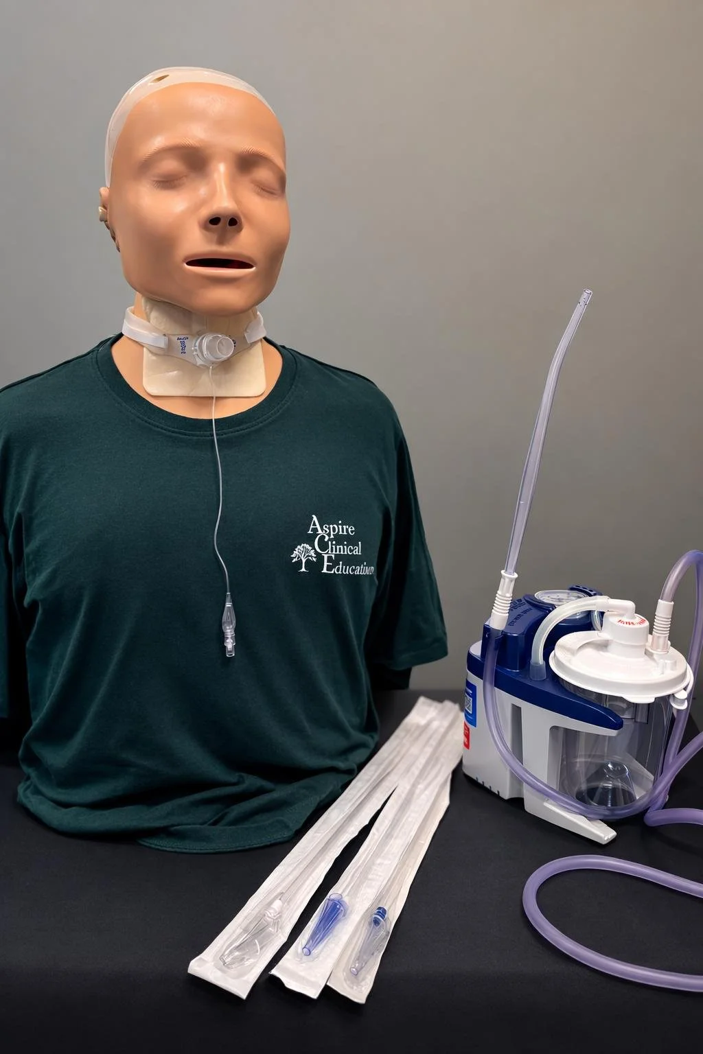 DeVilbiss suction machine and sim manikin