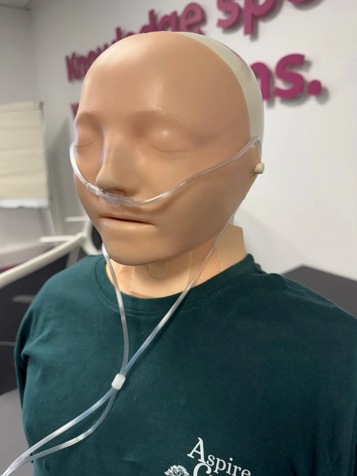 Sim manikin wearing a nasal cannula oxygen device