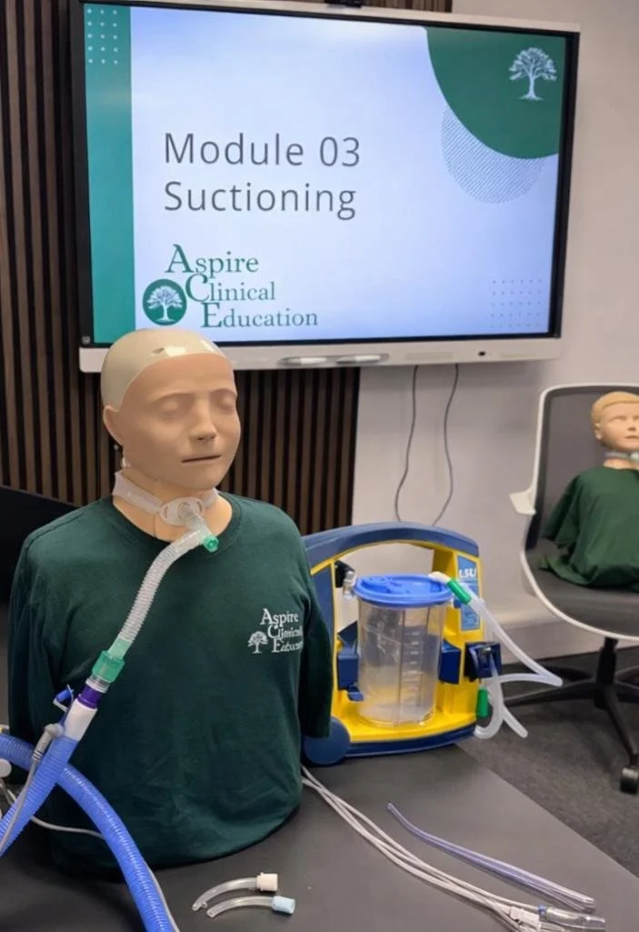 Set up of suction training with sim manikin, LSU machine and monitor