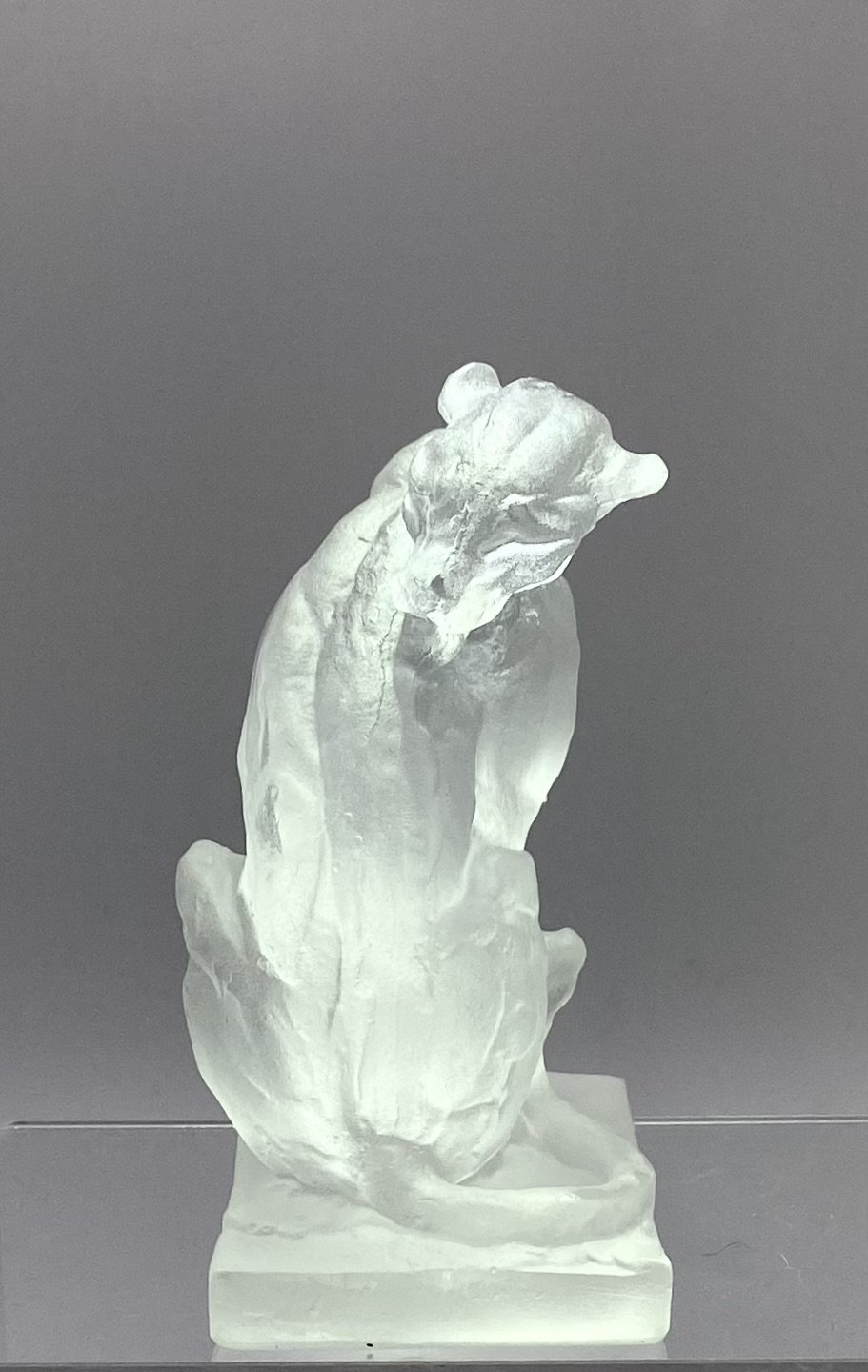 Glass Seated Grooming Leopard