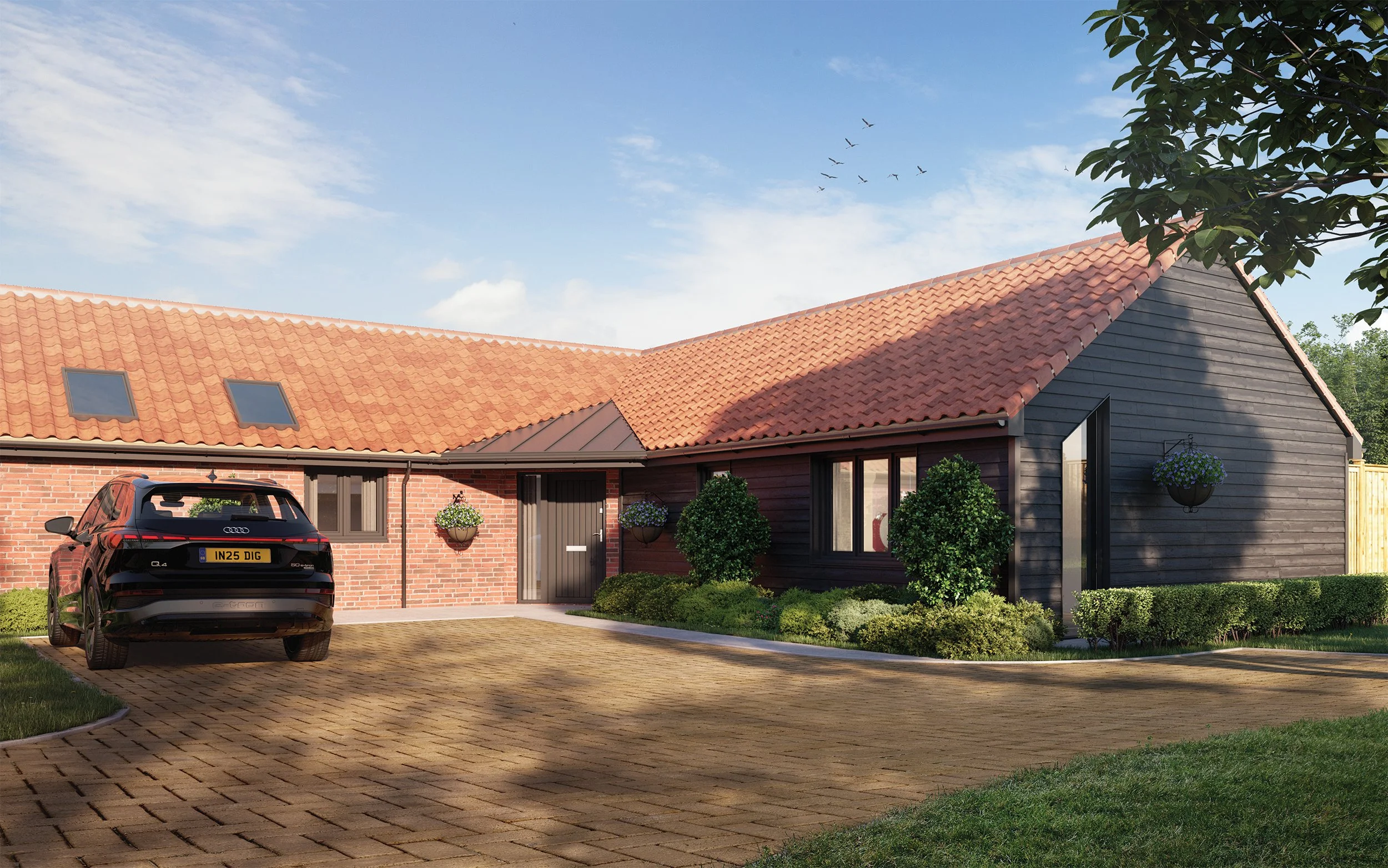 A modern single-story house with a brick and black wooden exterior, red tiled roof, and a paved driveway with an Audi Q4 parked. The house has hanging flower baskets and neatly trimmed bushes in the front yard under a blue sky with a flock of birds f