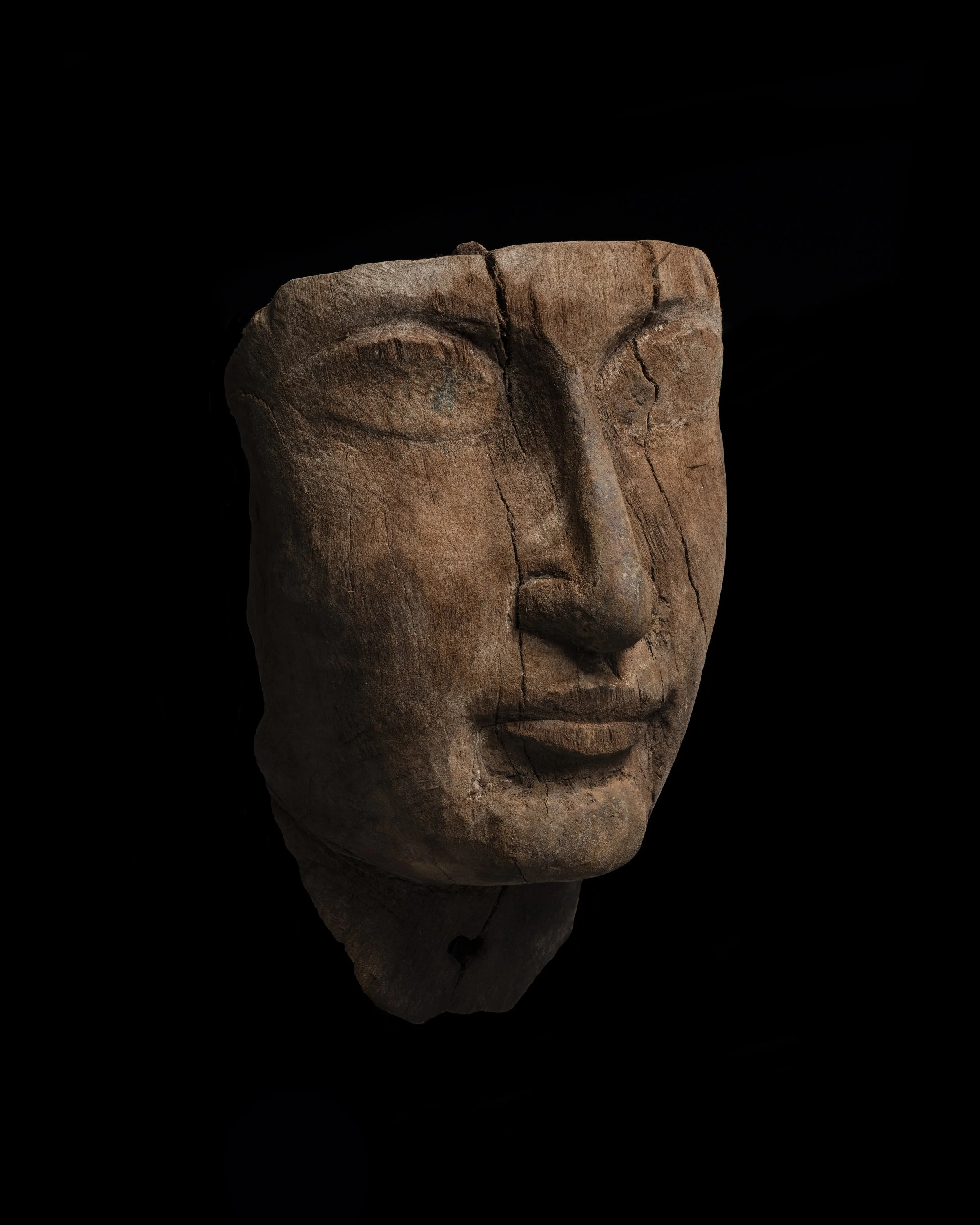  An Egyptian wood mummy mask , Late New Kingdom, 19th–20th Dynasty, c. 1295–1070 BC 
wood 
height: 17.5 cm